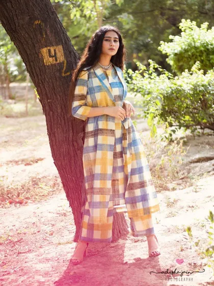 This shot captures the essence of my approach to fashion photography. I used the soft, natural light of an outdoor setting to highlight the flow and vibrant pattern of this plaid co-ord set from Taavi's collection for Myntra. The relaxed pose feels authentic and lets the outfit's personality shine through, creating an image that is both a lifestyle statement and a clear product showcase.