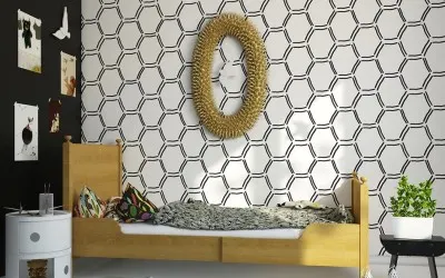 A bold, black and white honeycomb geometric pattern used as an accent wall in a bedroom. It creates a fun and graphic focal point.