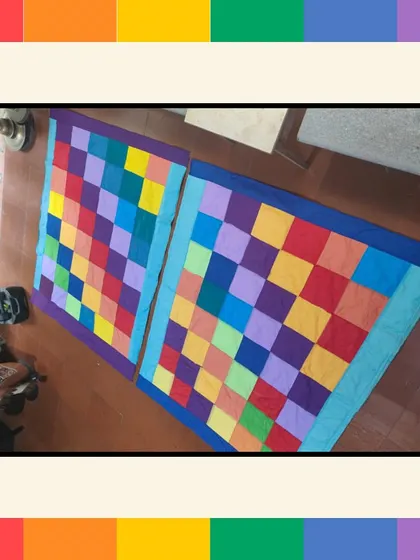 The finished Pride quilts, stitched together from patches created by employees at Intuit. These vibrant quilts were later donated to Sangama, an NGO supporting gender and sexual minorities, making the activity a true act of community support.