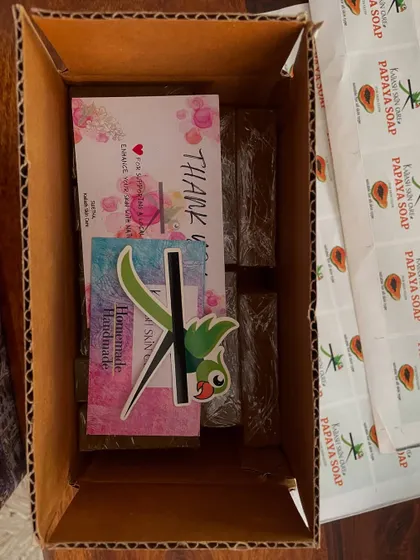 A peek inside a dispatch box of Papaya soaps. I always include my business card and a thank you note with every order.
