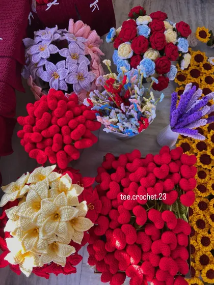 An overhead shot of various flower types ready for packing, including lilies, hearts, and forget-me-nots.