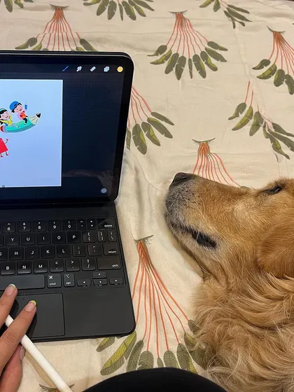 A top-down view of my workspace, creating a new illustration with my dog sleeping soundly by my side.