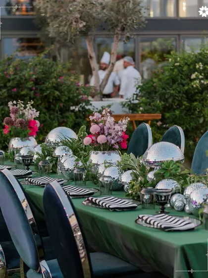 A whimsical tablescape from a welcome dinner in Turkey, featuring disco balls as vases. This playful yet chic detail shows our flair for creating unique and memorable decor that surprises and delights guests.