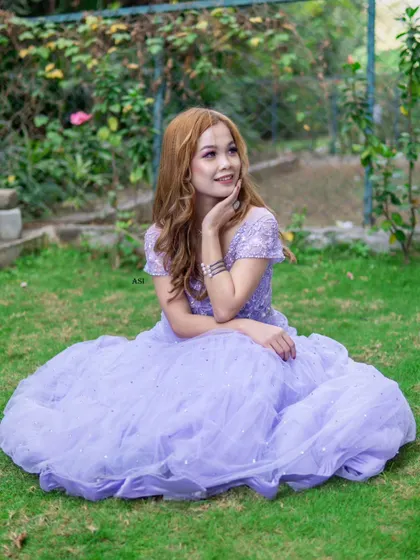 A beautiful shot from a photoshoot featuring a lavender lehenga. The soft color and sparkling details make it a dreamy choice for any special occasion.