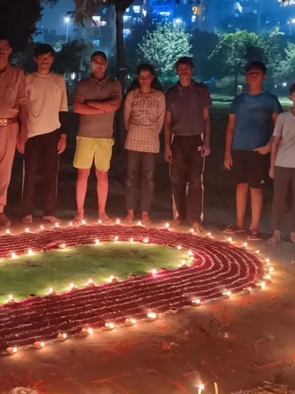 We are more than just a team, we are a family. Here we are celebrating Diwali together after a good training session. We created this running track rangoli to show our love for the sport.