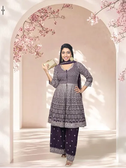 This embroidered purple peplum kurta with palazzo pants is a chic and sophisticated outfit. It's a great rental for a sangeet or cocktail event.