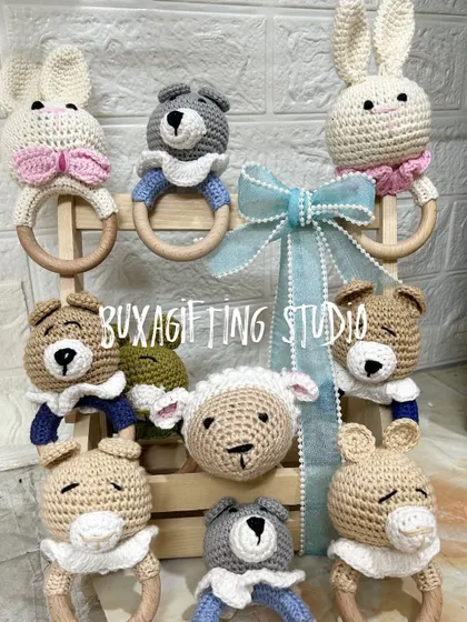 These handmade crochet rattles were created for a "BabyShire" themed event. Featuring adorable bunnies, bears, and sheep, they make for a timeless and charming baby shower gift or return favor.