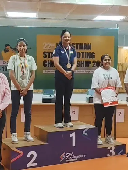 Devanshi Katara on the winner's podium, having secured gold medals in the Senior, Junior, and Youth categories.