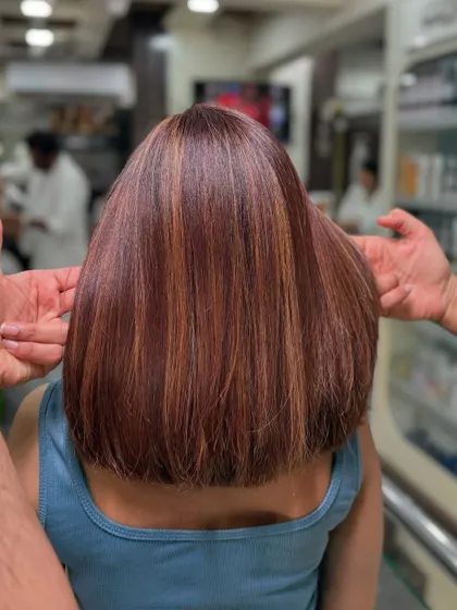 A sleek bob with a perfect mix of sun-kissed glow and brunette depth. This style is chic, modern, and full of dimension.