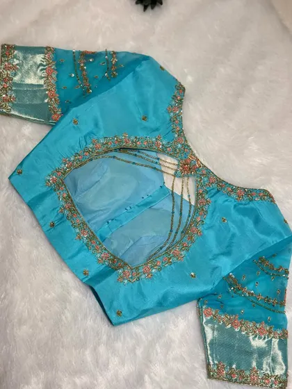 An ode to elegance in every stitch. The delicate bead hangings dance with every step.