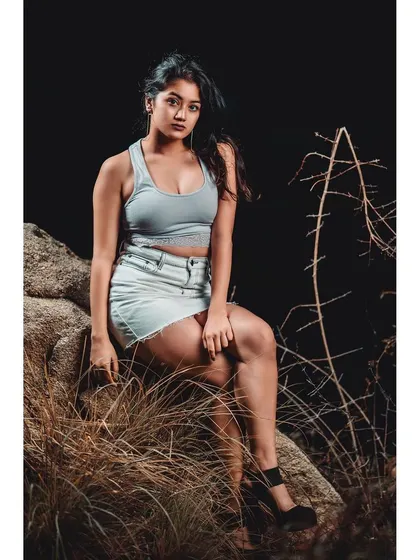 Night photography offers a different kind of drama. The harsh, direct light carves the model out from the darkness, creating a gritty and edgy fashion image.