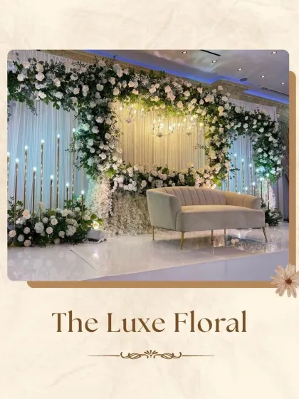 For a look of pure "Luxe Floral" elegance, I designed this stage with a grand arch of white roses and greenery. The clean lines, modern sofa, and soft lighting from candle-like fixtures create a sophisticated and timeless atmosphere.