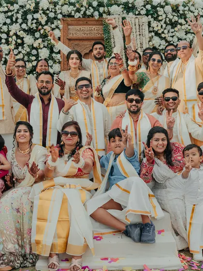 A beautiful family portrait from a South Indian Haldi, with everyone dressed in traditional attire. These are the pictures that will be cherished for generations.