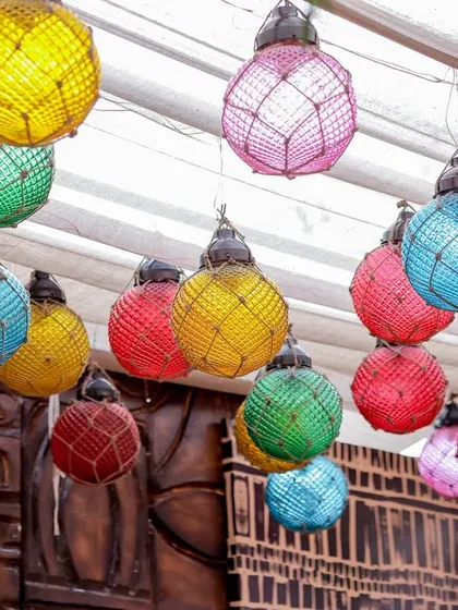 A cluster of colorful, netted lanterns that hung above the event space. These provided a vibrant pop of color and a festive, beach-party feel.