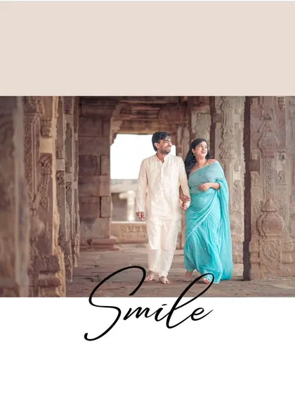 A simple, happy moment of the couple walking hand-in-hand through a temple corridor, their smiles telling the whole story.