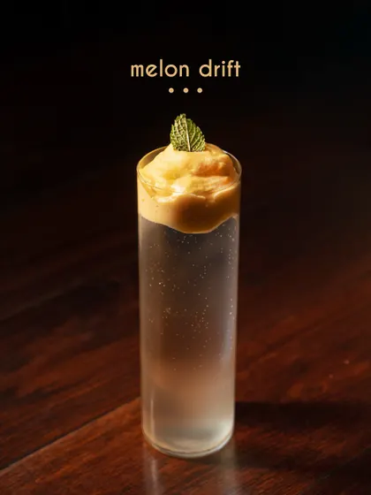 The Melon Drift is a study in texture and flavor. This layered drink combines the subtle sweetness of musk melon with a light, airy foam on top, creating a unique sensory experience with every sip.