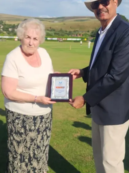 Presenting a memento to a representative of the Littleborough Cricket Club after our first match of the tour.
