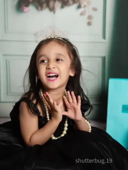 A moment of pure, unscripted laughter makes for the best portraits, even in a glamorous setup.