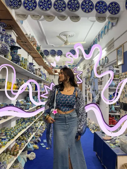 In a shop full of beautiful blue pottery, with purple doodles to add a whimsical contrast.