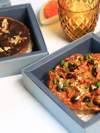 Our badam halwa pie and doda burfi tart, beautifully packaged in our signature gift boxes, ready to be shared and enjoyed during the festive season.