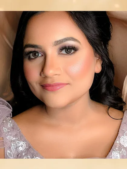 A beautiful close-up of the bride's reception makeup. The soft smokey eye and glowing skin create a look that is both glamorous and sophisticated.