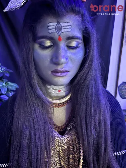 A divine fantasy makeup look inspired by Lord Shiva for Mahashivratri, featuring the iconic third eye and serene expression.