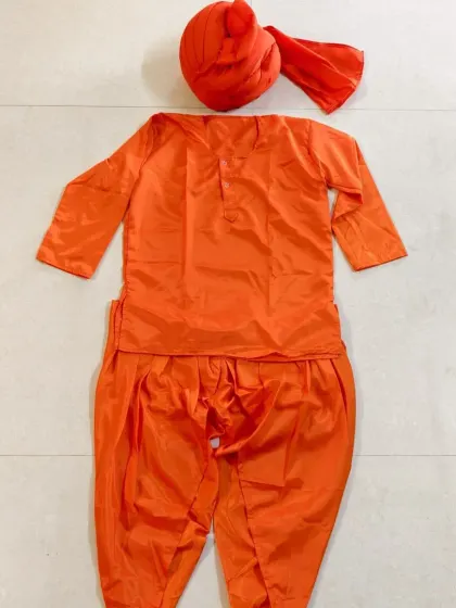 This bright orange kurta set with a matching turban is perfect for portraying spiritual leaders like Swami Vivekananda. It is a complete set that is both comfortable and visually striking.