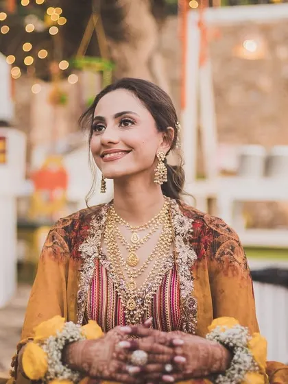 A candid portrait of the bride, Bhavita, looking radiant and serene during her Haldi celebrations.