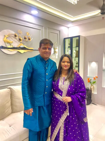 A lovely photo with the Nikam couple in their new living room. The elegant wall moulding and decor pieces reflect their sophisticated style.