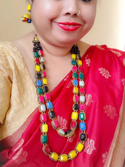 Here I am wearing the two-layered 'maharani' necklace to show its scale and how beautifully it drapes. This helps buyers understand the impact of this statement piece.