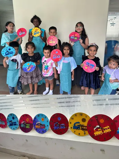 A whole class of little clock-makers. These kids are so excited to show off the colorful clocks they painted themselves. It's a fun, functional art project that they can use and be proud of.