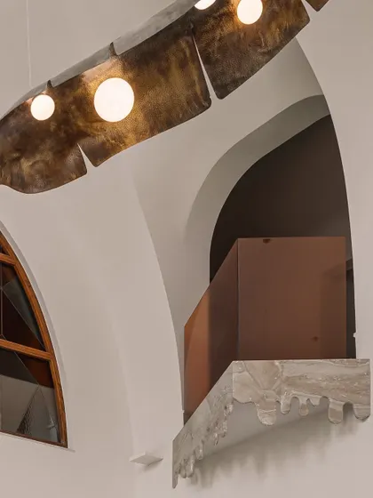 A detail of the triangular Juliet balcony with its scalloped marble edge, a small but significant architectural moment.