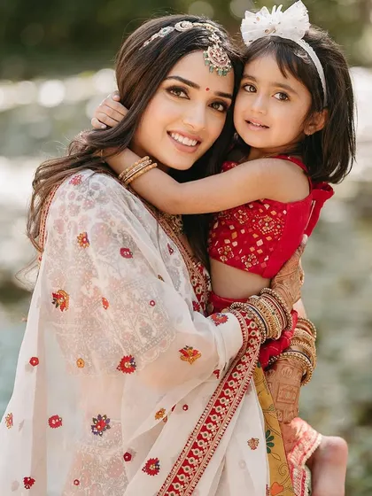 A precious moment between the bride and a young family member during her Mandap Mahurat ceremony.