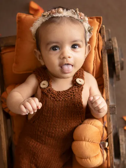 A playful moment. Sticking her tongue out, this little one is showing off her fun and cheeky personality.