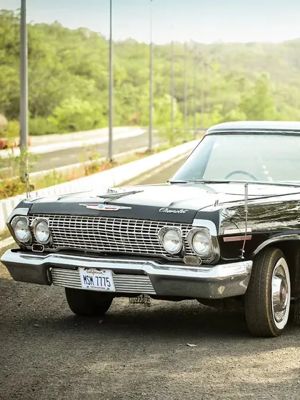 Sometimes the prop is a star in its own right. We use unique elements like this vintage Chevrolet to set a specific mood and theme for your pre-wedding photoshoot.