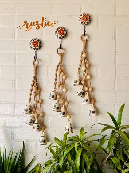 A beautiful display of our 'Symphony Chimes' in the 'Rustic' variant. The natural jute twine and wooden beads give these chimes a warm, earthy feel, perfect for a bohemian decor style.