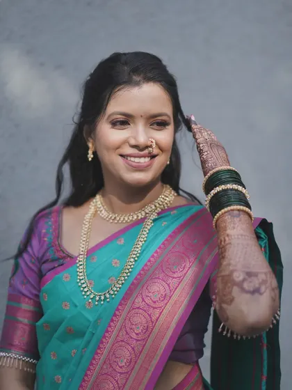 A candid and happy moment. The bride's makeup is light and comfortable, allowing her natural joy to be the centerpiece.