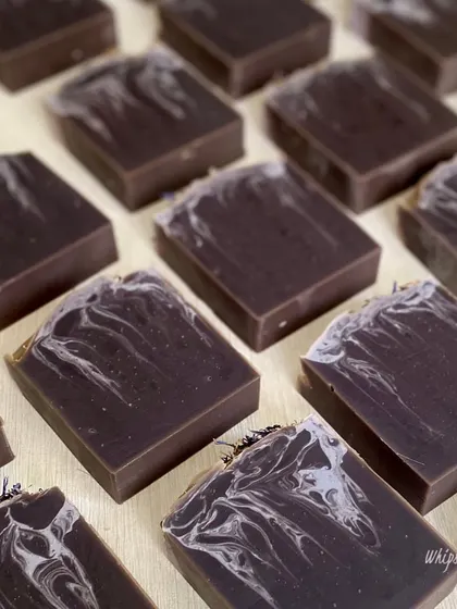 A collection of our Purple Rain bars, each with a unique swirl pattern. This soap is part of our essentials collection, designed for everyday luxury and gentle skin nourishment.