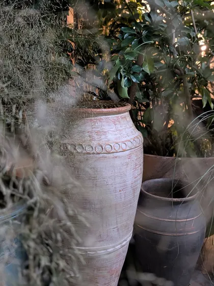 A close-up from the Anita Dongre 'Vaana' collection preview. We used large, antique-style terracotta urns and filled them with soft, feathery grasses to create a dreamy, rustic texture that perfectly matched the event's enchanting forest theme.