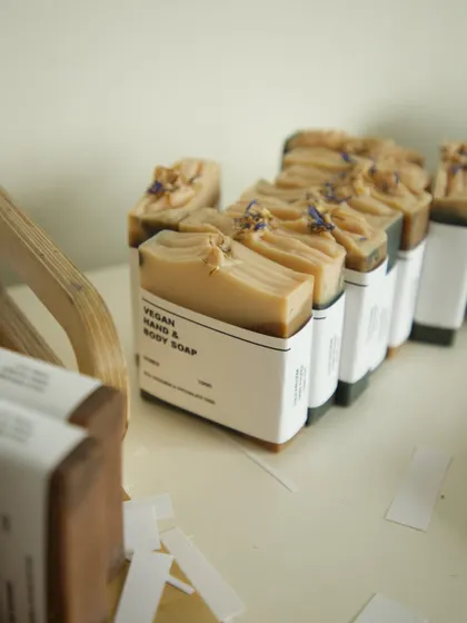 A snapshot from my packaging table, a part of the process I rarely remember to capture. Here are some soaps being wrapped in their new belly bands.