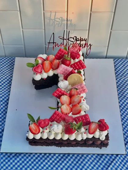 A first anniversary celebration deserves something special. This number "1" shaped tart-cake is loaded with fresh strawberries, ruby chocolate, and creamy frosting.