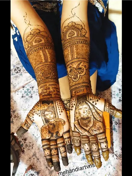This design showcases detailed portraits of a bride and groom, each on one palm, ready to be joined together. The artwork is framed by traditional motifs.