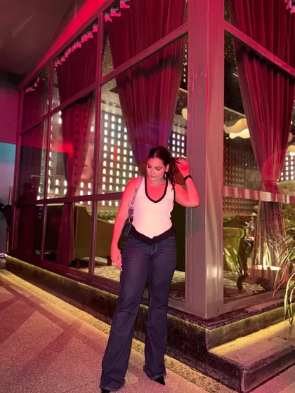 Playing with light and shadow, this outfit is perfect for a night out at a stylish venue.