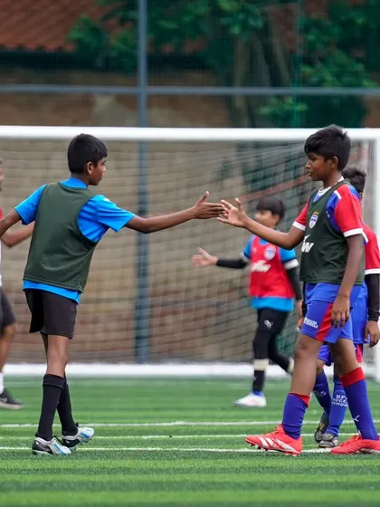 Sportsmanship is key. Players shake hands after a competitive "Blue Derby" match between our Young Blues Elite and the BFC Academy.