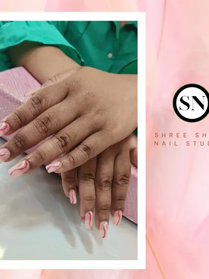 A beautiful example of brush art with these elegant pink and white swirls on a nude base.