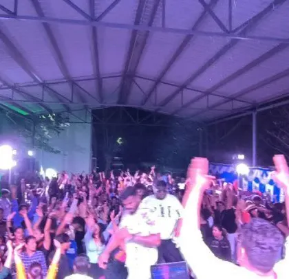 Hands in the air from the entire crowd at this high-energy corporate event.