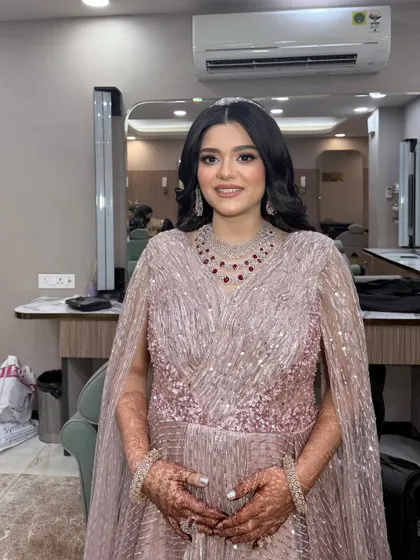 The full look, showing the elegant gown and the perfectly coordinated soft glam makeup.