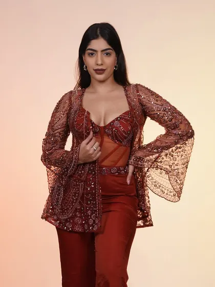 This rust-colored corset and jacket set is for when you want to skip the traditional and go straight for the kill. It’s the perfect fusion look for a sangeet or cocktail party.