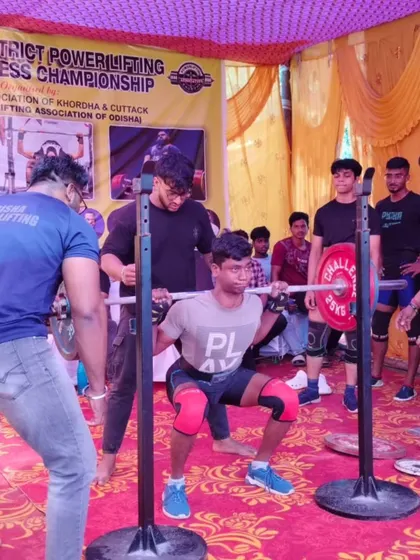 A young lifter showing great form at a district championship. We build our athletes from the junior ranks up.