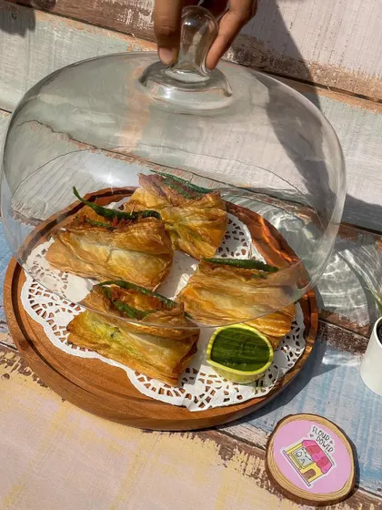 My vada pav puffs served under a glass cloche, ready for a party. They make a great and unique appetizer.